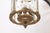 Elegant neoclassical lantern crafted in patinated bronze with faceted crystal panels and refined foliate detailing. The...