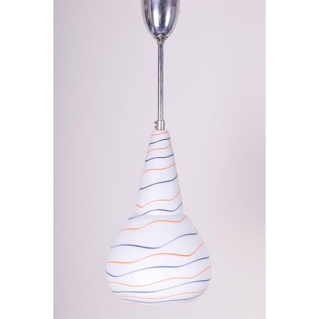 This stylish pendant chandelier dates back to the 1960s and is a prime example of Czechoslovak design that harmoniously...