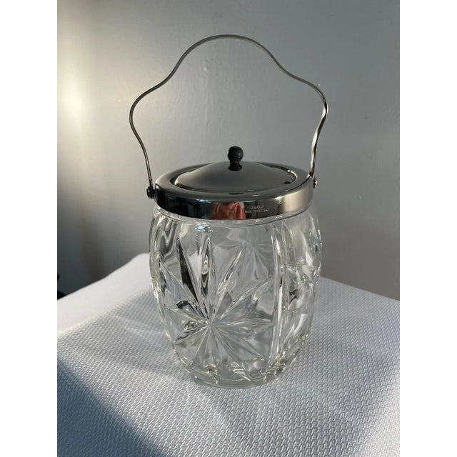 A brilliant and sharply clear Cut Glass Biscuit Barrel with silver plated trim, handle and lid. 'Made in England'...