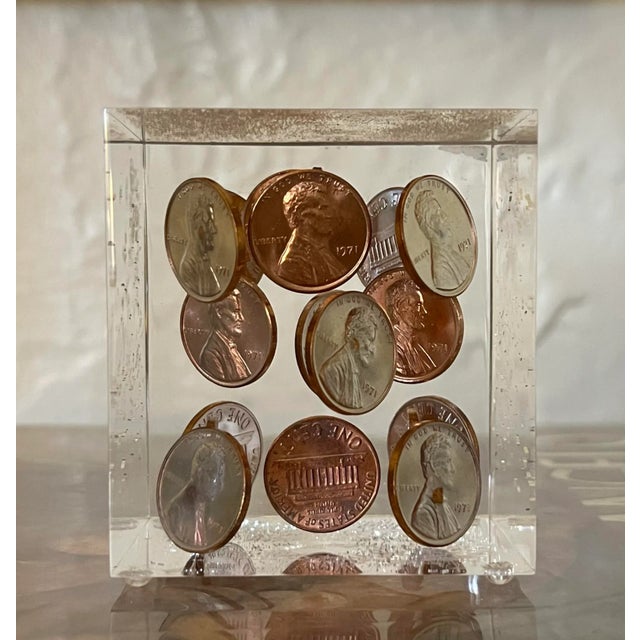 A striking piece of vintage Americana, this 1971 Lincoln Lucite paperweight is a timeless blend of design and history....