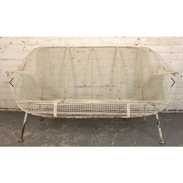 Mid-century modern American made outdoor sofa designed by Russell Woodard for his 'Sculptura' series. Featuring an all...