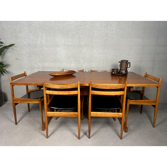 Dining room set by Rik Gerard and Jos De Mey for Van Den Berghe Pauvers in 1966. 6 chairs 'Golden Badge' in walnut and...