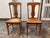 Design Plus Gallery presents a pair of Vintage Limbert Style Oak Cane Side Chairs. The chairs have arched crest rails,...