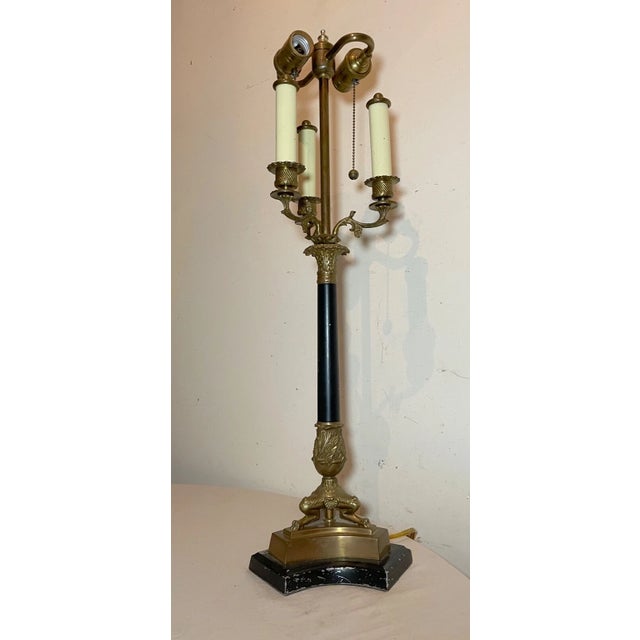 Add a touch of vintage elegance to your living space with this tall bronze table lamp. The lamp features an ornate...