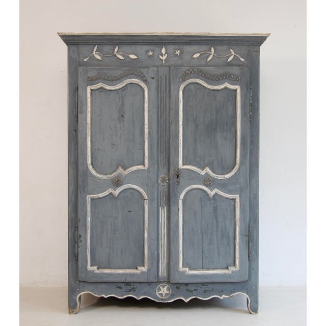 A French provincial cabinet or kitchen cupboard from the 19th century. Solidly crafted from pine with beautiful slightly...
