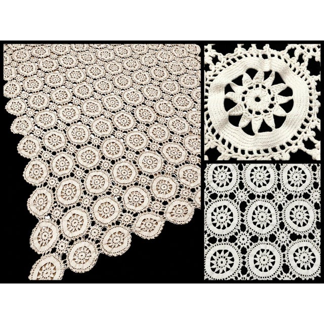 This is an elegant ivory crochet lace textile featuring a beautiful repeating pattern of circular floral medallions. Each...
