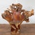 A vintage Chinese hand-crafted camphor wood root chair from the 20th century, with light varnished patina and unusual...
