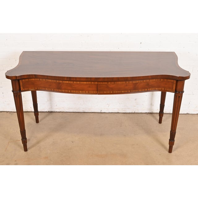 An exceptional English Regency Louis XVI style serpentine front sideboard, buffet server, or console table By Arthur Brett...