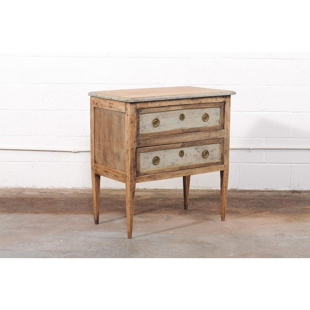 A charming French raised chest of two drawers, notable for its appealing small scale and elegant, uncomplicated form, from...