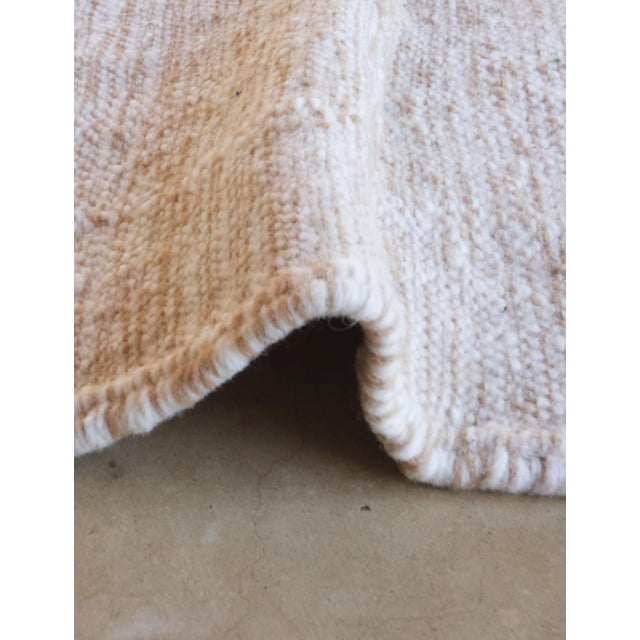 Tiny Moroccan Flatwoven Rug – Handwoven Wool with Minimal Stripe Design (One of a Kind) This tiny Moroccan flatwoven rug...