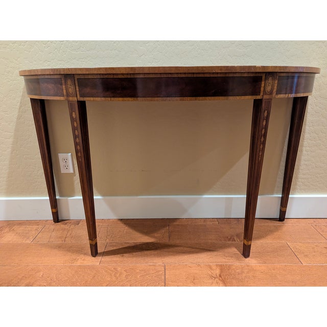 Display your treasures on this Henkel Harris Federal Inlaid Mahogany Console Hall Table (Model 5724) Measures 54ʺW × 16ʺD...