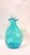 A 1950’s era American made art glass blue pinched decanter with clear stopper.