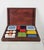 Vintage Italian games box, dating from the mid-20th century, made with a richly figured burl wood case and gilt brass...