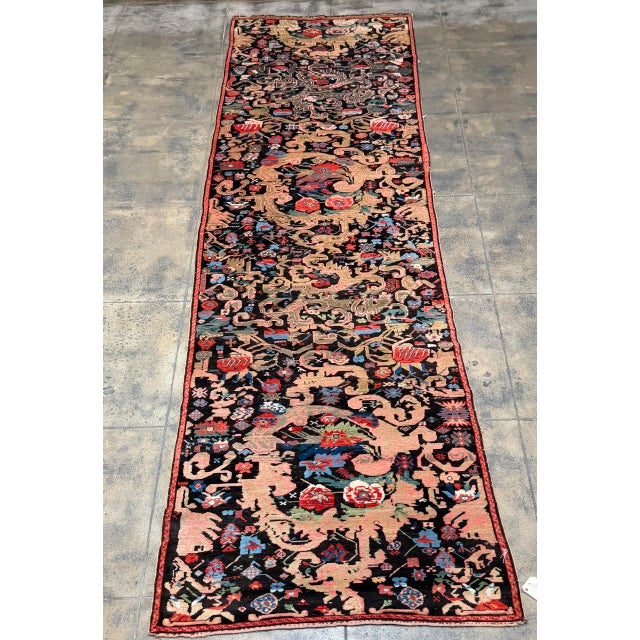 This exceptional antique Karabagh runner, dating to approximately circa 1900, measures approximately 12'2" x 3'5" and...