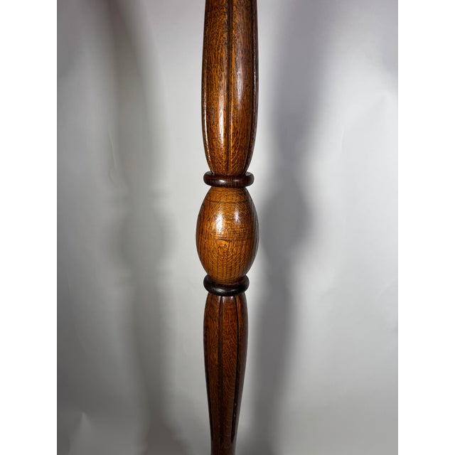 This vintage floor lamp brings timeless warmth and classic charm to any interior. Featuring a solid turned wood base with...