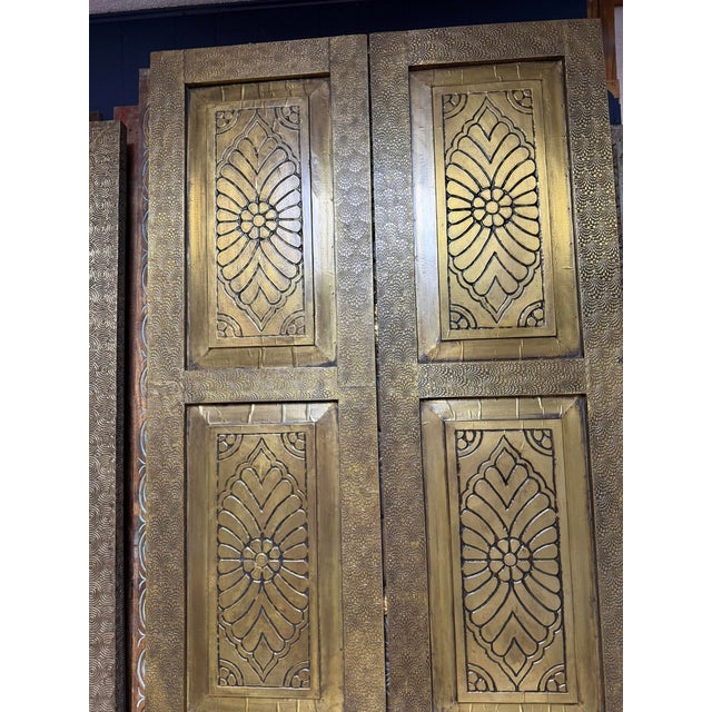 Make a dramatic architectural statement with this exceptional pair of vintage brass-clad double doors. Featuring a...