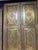 Make a dramatic architectural statement with this exceptional pair of vintage brass-clad double doors. Featuring a...