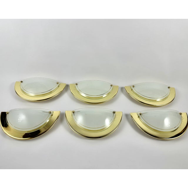 Vintage wall lamps from massive lighting, belgium, circa 1970s. the sconces are made of high quality glass with gilt metal...