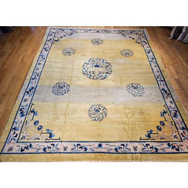 A truly beautiful and rare oversized Chinese Peking rug in a near square size from the late 19th century. This piece...