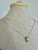 Contemporary Minimalist curved pendant on a fine matching chain. The polished sterling silver pendant is stamped "925",...