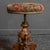 An attractive walnut piano stool from the late Victorian period. The carved and splayed legs give way to a carved and...