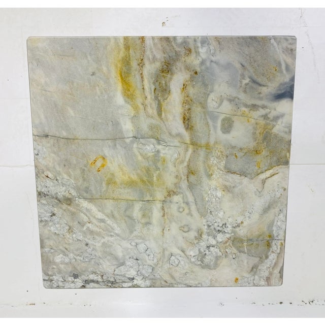 This is a mid century vintage modern marble side table or pedestal. This Italian marble side table is made of a light gray...