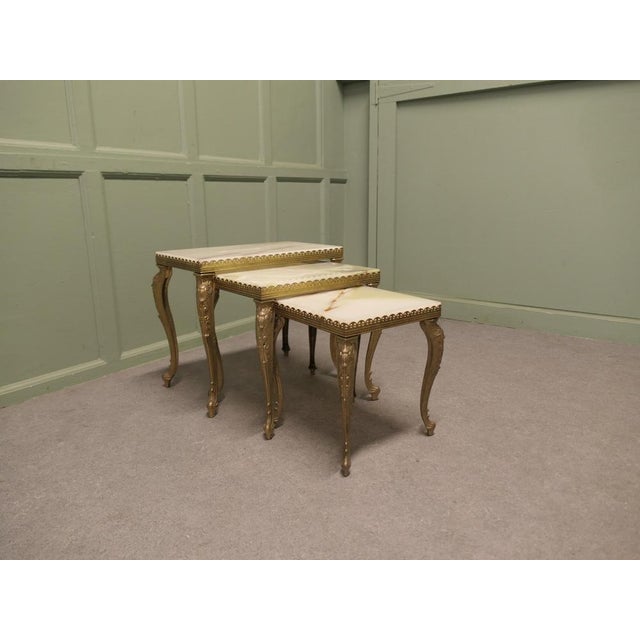 Nest of 3 Brass and Marble Topped Tables This is a very attractive set, the tables a have decorative brass frame with...