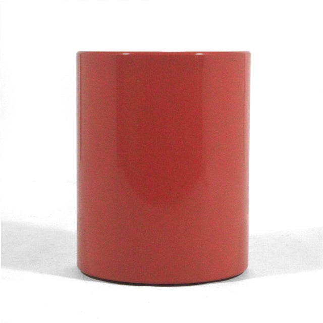 This minimalist, cylindrical side table or pedestal by Metro is finished in a beautiful "Desert Red" color. 20.25"h X 15.75"d