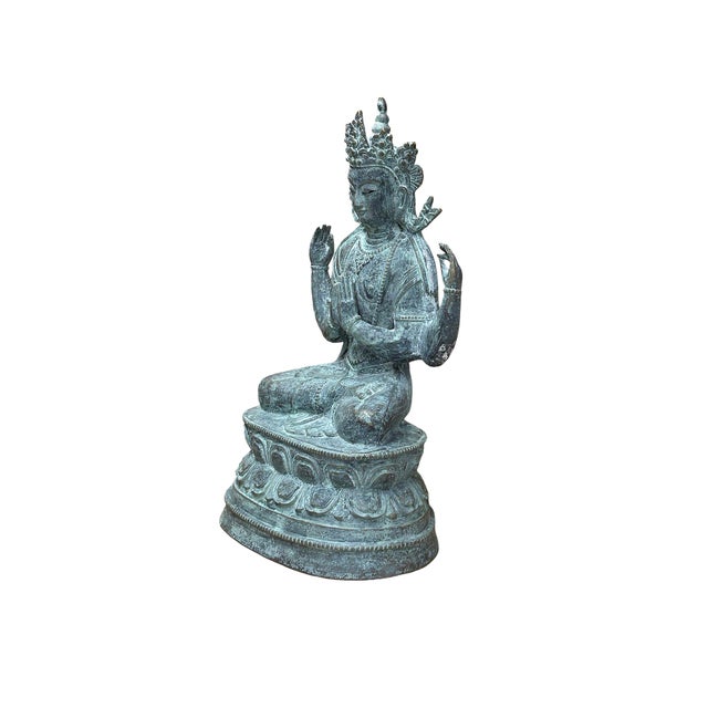 Discover the serene elegance of this exquisite bronze statue, a masterful representation of traditional Asian artistry...