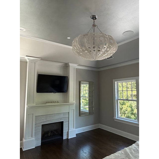 A sculptural statement piece from Oly Studio, the Luna Bowl Chandelier is hand-cast in pierced resin with an organic, sea-...