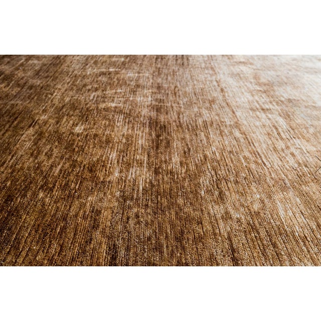 This beautiful hand knotted 100% silk cut pile rug in a stunning brown and gold ombre pattern is brand new and would be a...