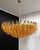 Elegant italian pendant light made from 185 amber murano glasses "poliedri". Structure in gold and brass colored metal....