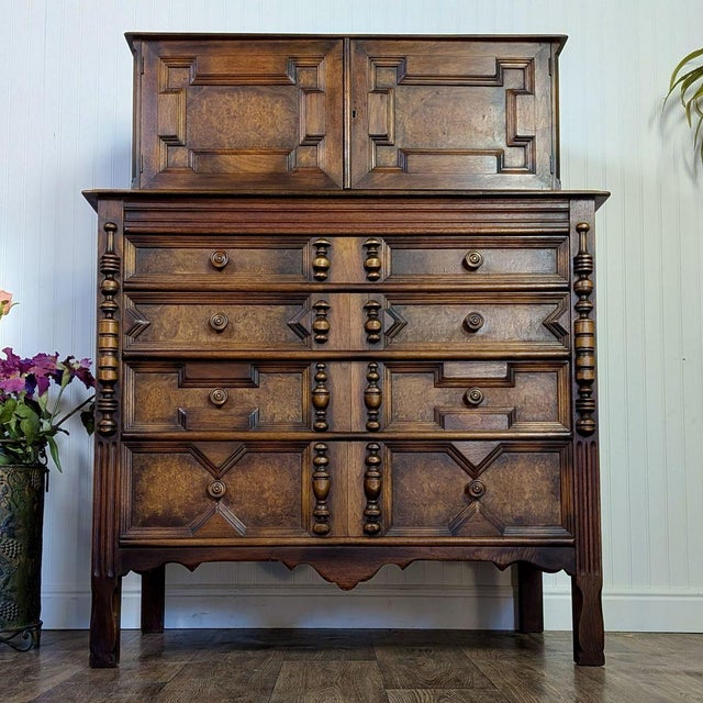 Striking vintage tallboy dresser with three hidden top drawers. This piece is unique in that it has several stunning...