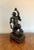 Quality large antique Japanese bronze figure having a quality large antique Japanese bronze figure of a man holding his...