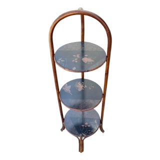 1970s Costal Three Tiered Dark Stained Rattan Shelf w East Asian Motif Tops For Sale