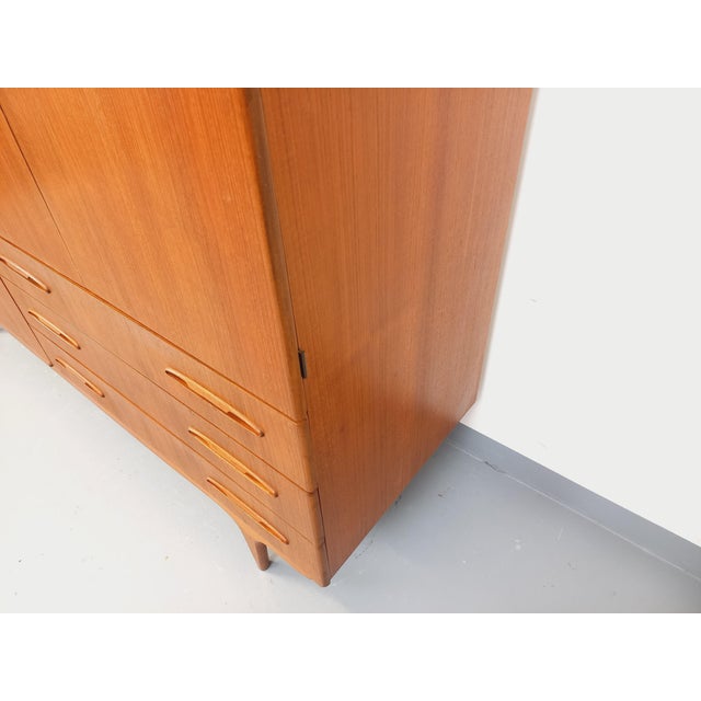 Vintage Scandinavian teak wardrobe from the 1960s, very high quality, beautiful rounded finish, superb handles, and...