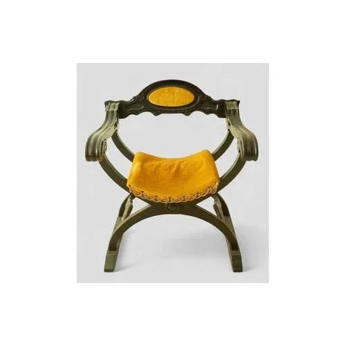 Refined Savonarola chair in turned dark wood, featuring the classic crossed “X” structure typical of Renaissance style....