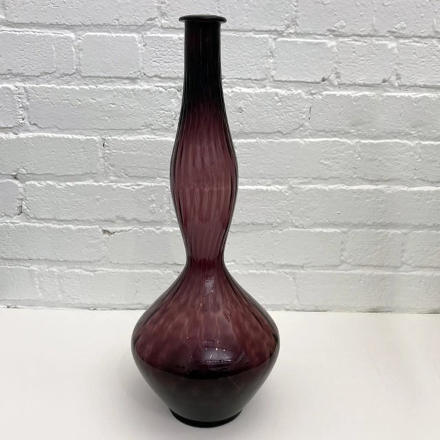 Italian Mid-Century Modern tall blown Genie Bottle, vessel, decanter in translucent amethyst purple from Italy, 1960s....
