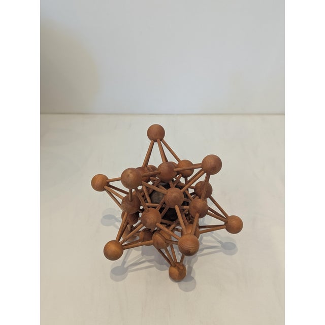 A mid-century wooden molecular model sculpture, attributed to Science Research Associates (SRA) Constructed from turned...