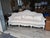 Elegant and romantic, this French Louis XV–style sofa features a beautifully shaped exposed-wood frame finished in a...