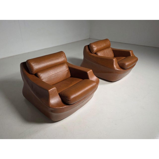 Exceptional pair of sculptural Italian lounge chairs dating from the late 1960s or early 1970s, attributed to the design...