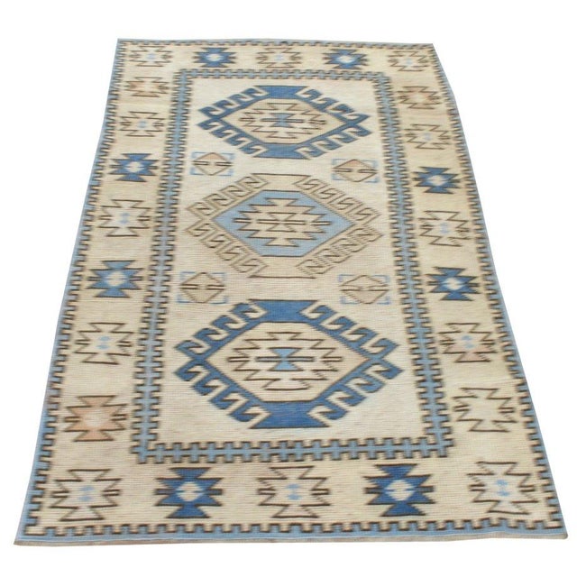 Hand-knotted with care using traditional rug-making techniques, this wool rug blends timeless craftsmanship with a modern...