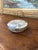 This believed to be antique Chinese porcelain lidded box features classic blue and white hand-painted decoration with a...