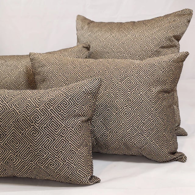 Add a bold touch of luxury to your space with this stunning decorative pillow crafted from the fabric 'Amazement' by...
