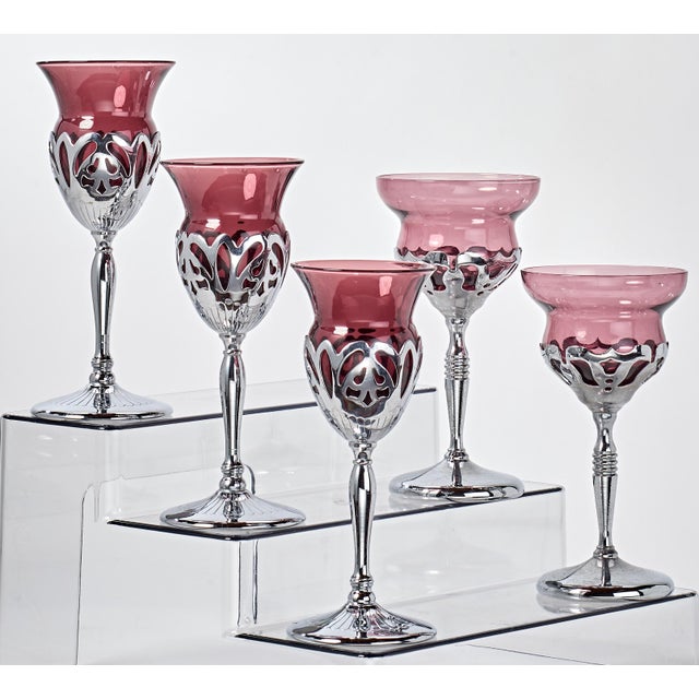 Elegant drink ware with finely crafted chrome stems. 3 champagne and 2 wine.