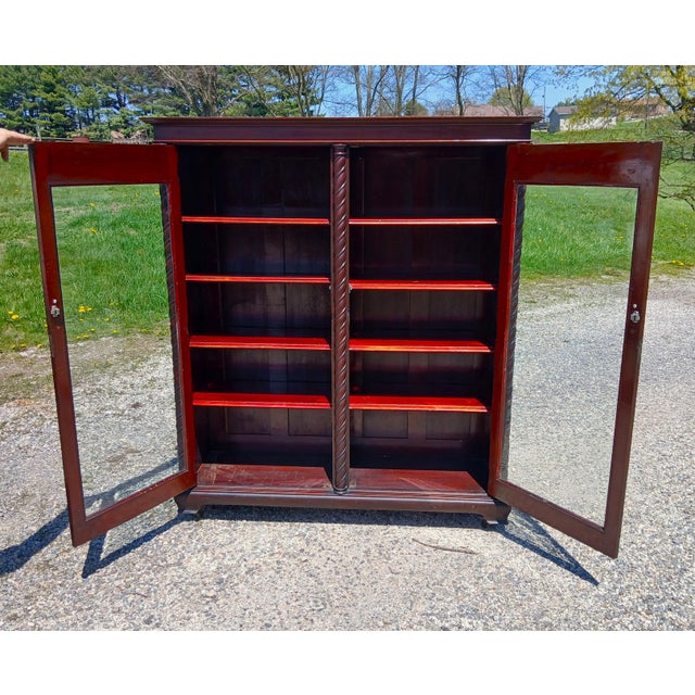 Antique Mahogany 2 Door Bookcase with Rope Spiral Columns 1895 An antique one piece solid mahogany bookcase with two glass...