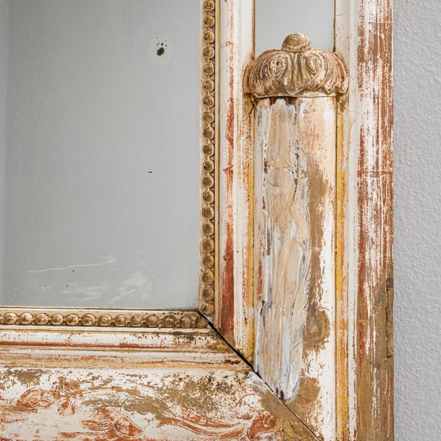 This exquisite 1880s French wood mirror features a stunning white patinated finish, evoking a sense of refined elegance...