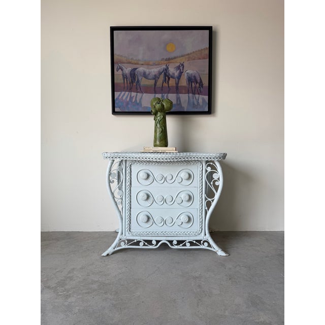 Charming vintage Palm Beach-style wicker chest featuring the iconic “Sweet Fiddlehead” design, known for its whimsical...