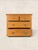 This antique English pine chest of drawers brings warmth, character, and practical storage to a collected interior....