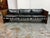 Design Plus Gallery presents a Circa 1970's Rosewood + Black Leather Strap Sofa from Selig Furniture. Architectural lines...